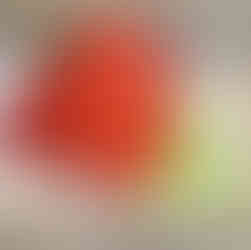 A plate of chicken wings coated in hot cheeto powder