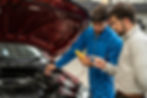 A mechanic checking a car’s electrical systems