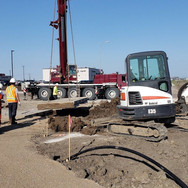 Workers and machines on a construction site