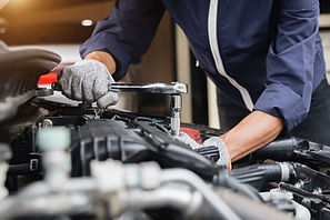 A mechanic performing maintenance on a car