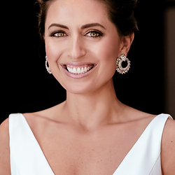 Smiling woman with elegant event hair styling
