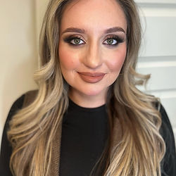 Woman with long blonde wavy hair after event styling