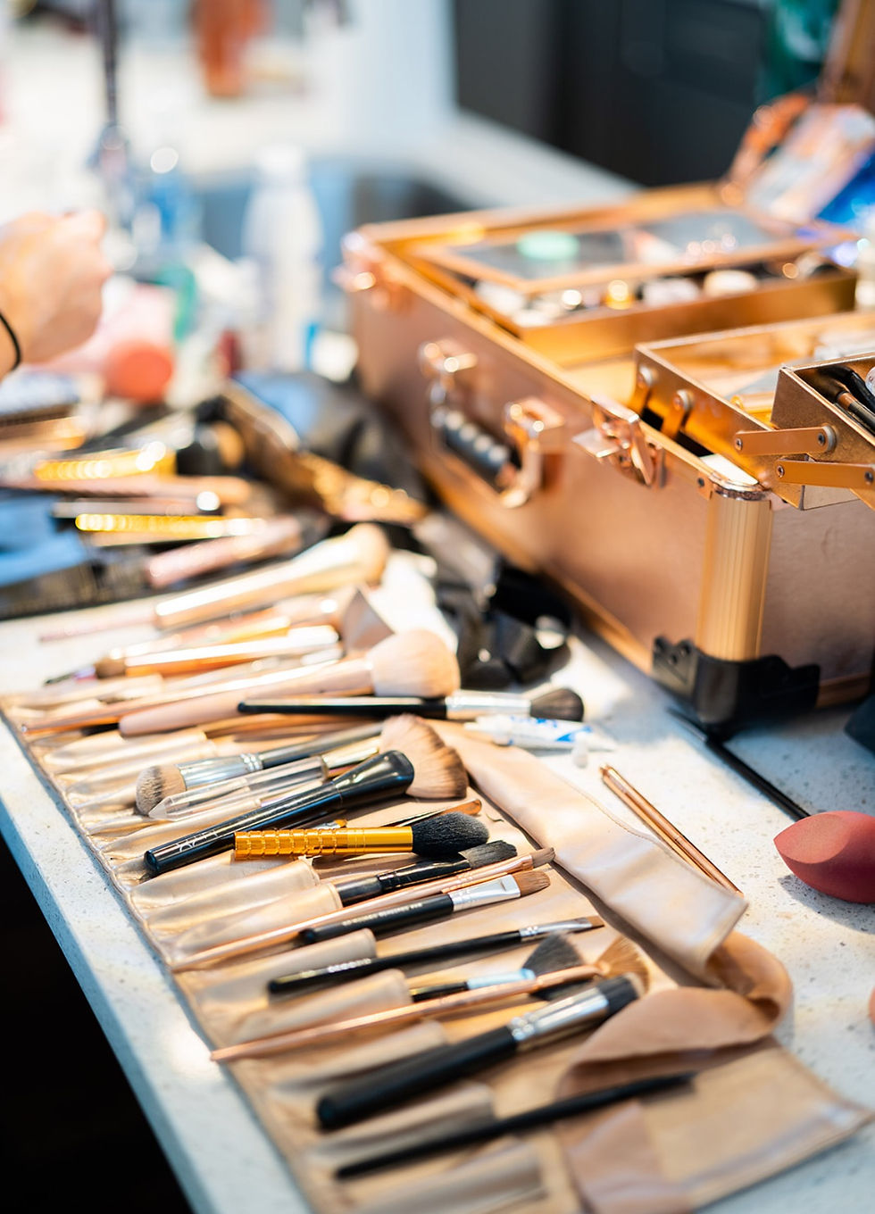 Close-up view of luxury makeup products arranged neatly on a vanity