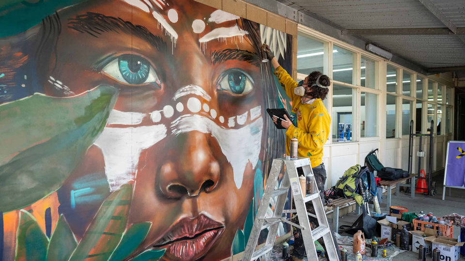 Melbourne graffiti artist painting aboriginal art mural