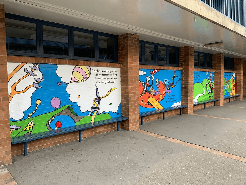School playground kids book mural at Sydney School