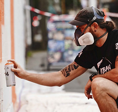 Graffiti artist spray painting mural in Sydney City.jpg