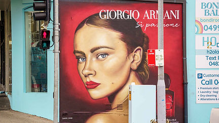 Hand-painted graffiti mural of Sadie Elizabeth Sink promoting Armani Beauty Si Passione Intense in Bondi Beach.