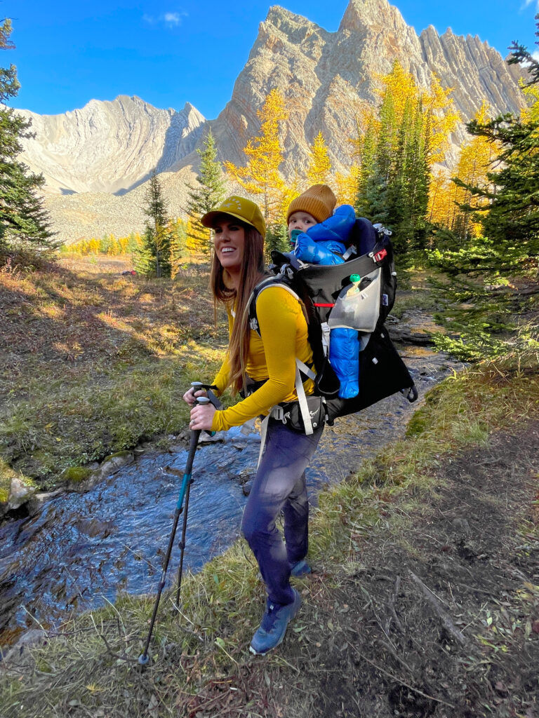 Adrianna carriers her young son in an Osprey Poco Plus on a mountainous hike.