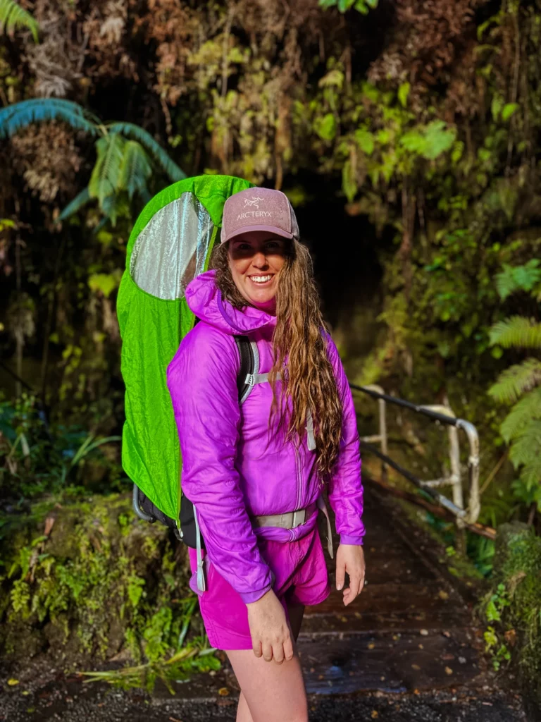 Adrianna carriers her young son on her back while they hike Kilauea Iki Trail and Crater Rim.