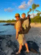 Adrianna and her young son enjoy a beach view in , one of the best Big Island Family Hikes.