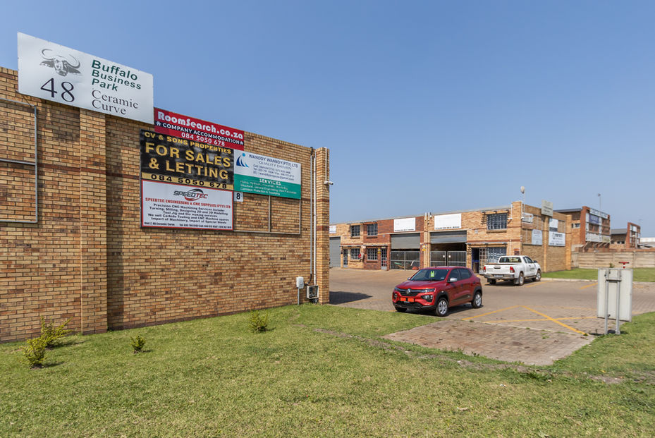 Exterior view of a large industrial warehouse in Richards Bay available for lease.