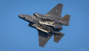 F-35A Lightning II in flight with internal weapons bays open
