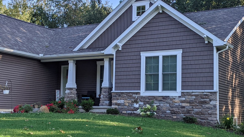 Layered Cliftrock blend of soft buffs, tans, and light grays, creating a warm, grounded base that complements traditional siding and trim.
