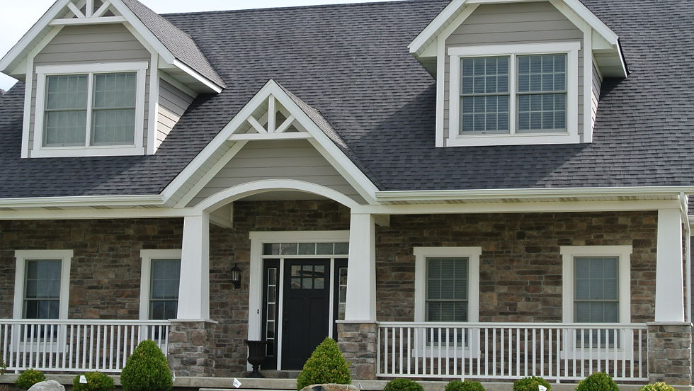 Deep brown-gray stones with subtle variation create a rich, grounded base that pairs beautifully with white trim and classic porch details.