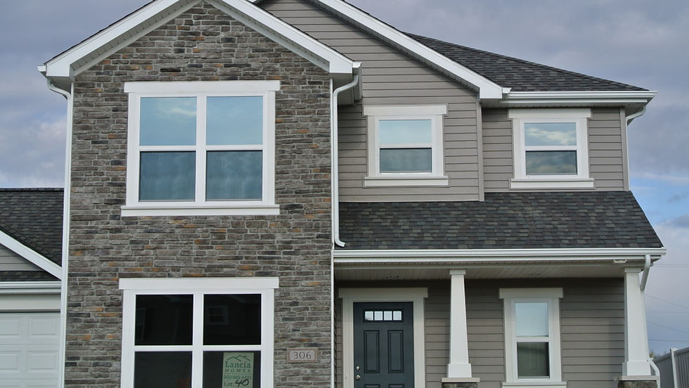 Slim linear Laytite stone in cool grays with soft buff accents, creating a clean masonry-brick look that pairs beautifully with contemporary siding.
