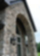 quartz price stone veneer on entry way of custom home