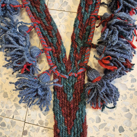 Detail from a set of straps that Razi wove