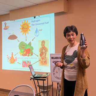 trusii, woman holding trusii water bottle during health demonstration
