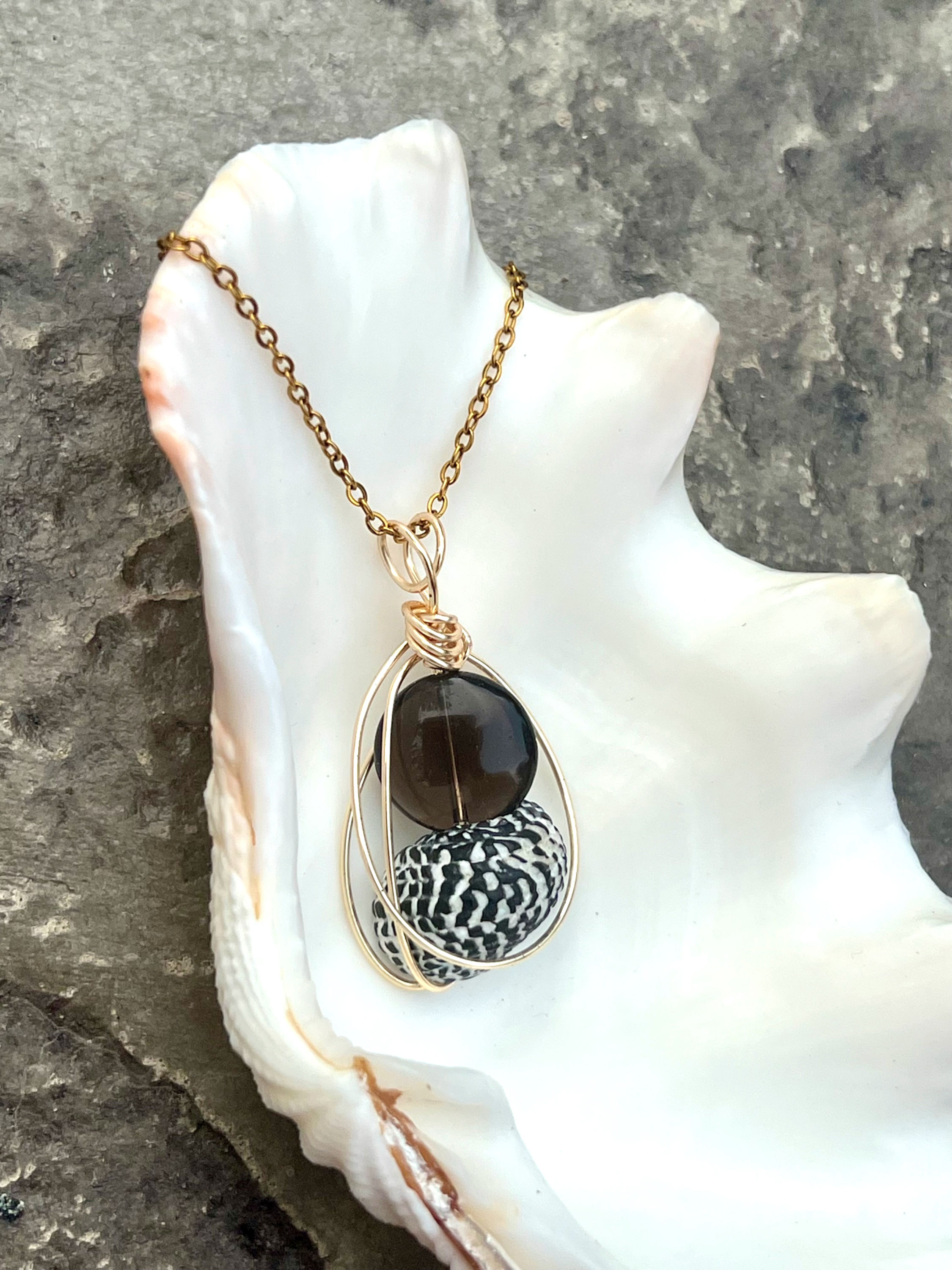 Black & White Shell with a Brown Glass Bead