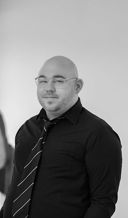Consultant Tim Campbell Smith looking at the camera in a photography studio