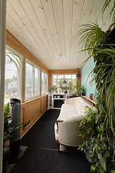 Small room with couch and plants at Robin's Nest in Guelph Ontario