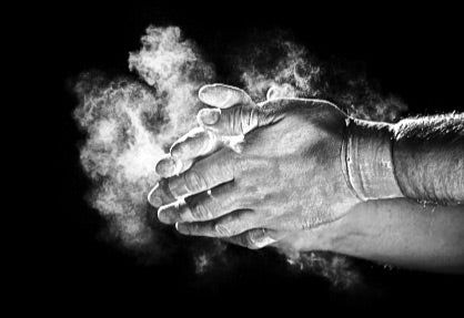 Chalked hands preparing for strength training at Temple Built gym in Wappingers Falls