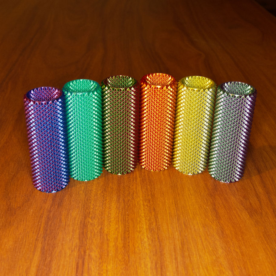Assorted Press 360 sensory fidgets arranged together, showing tall dual-textured cylindrical forms.