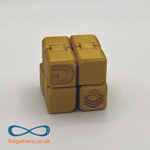 3D printed iCube fidget cubes by Fidgetiers shown in Gold