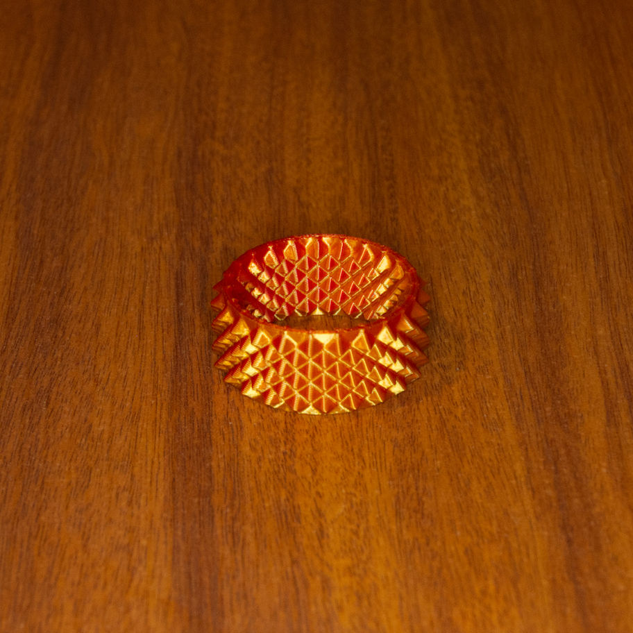 Dual-colour Pocket Press standing upright with rounded dual-point texture across the outer surface.
