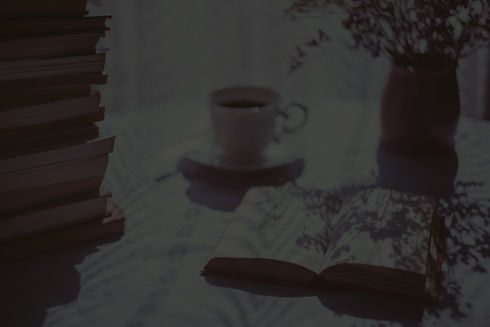 open%20book%20beside%20white%20ceramic%20teacup%20on%20saucer_edited.jpg
