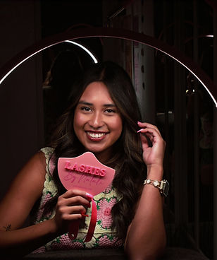 Natali, lash extension artist at Bee's Knees Beauty in McKinney, holding her Lashes mirror