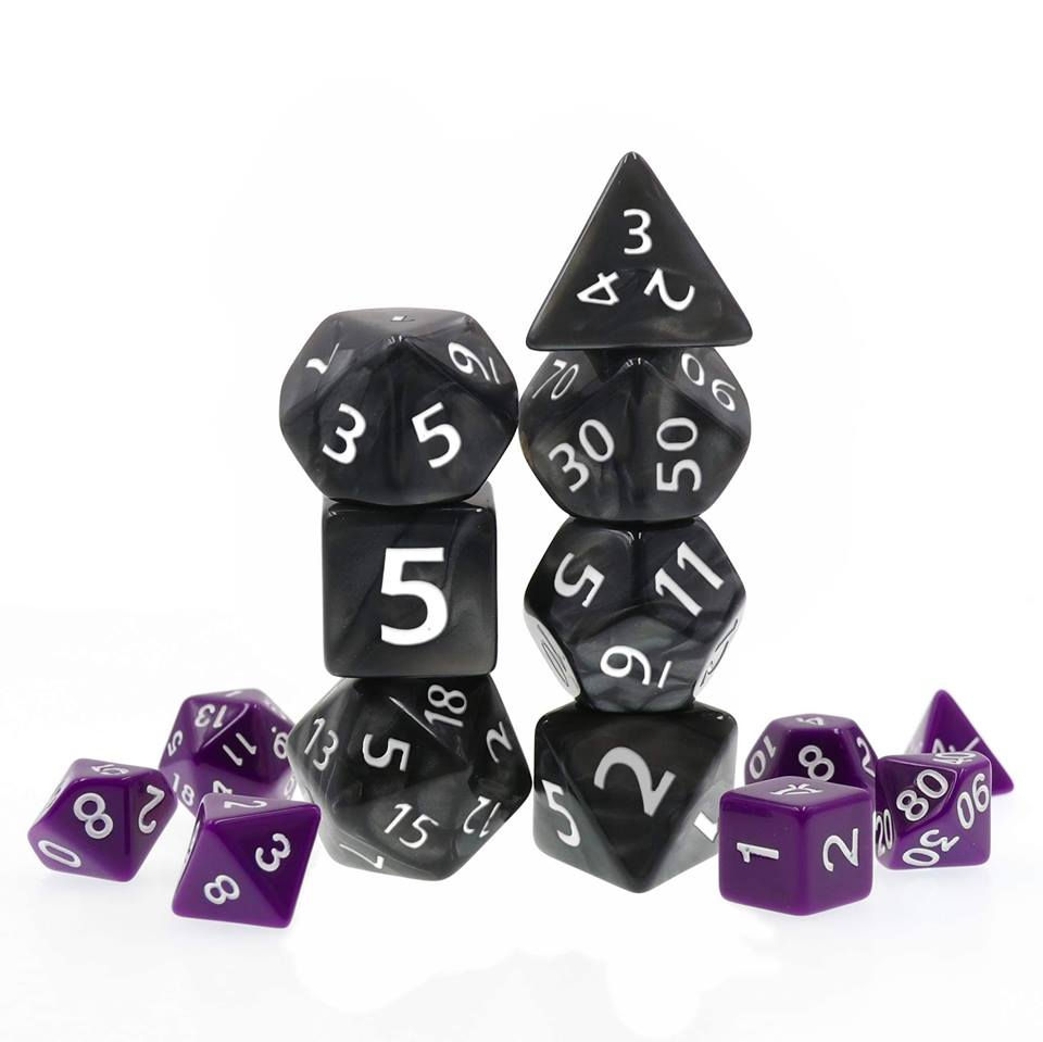 2 sets of polyhedral dice: purple with white ink next to neatly stacked large black dice with white ink