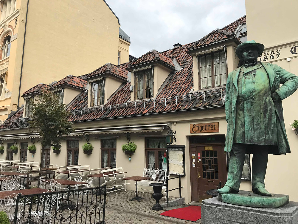 Engebret Cafe with statue from the outside in Oslo, Norway