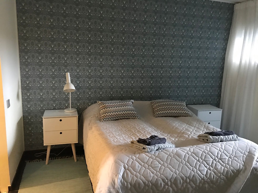 Double bedroom on the ground floor with vanity mirror, villa Tuusula Finland