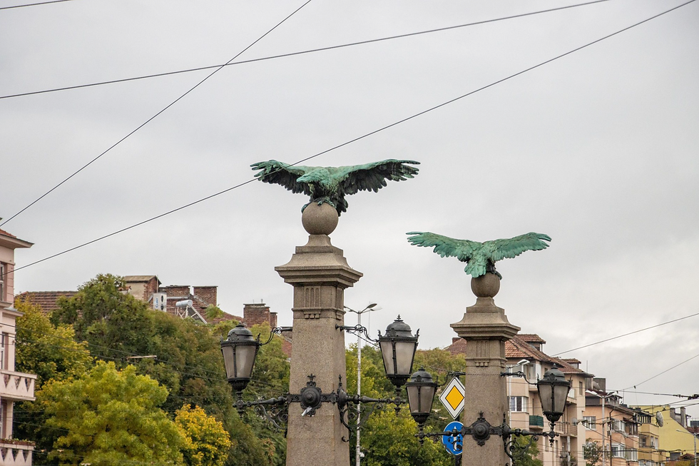 The top of bridge pillars with giant copper eagles on them.