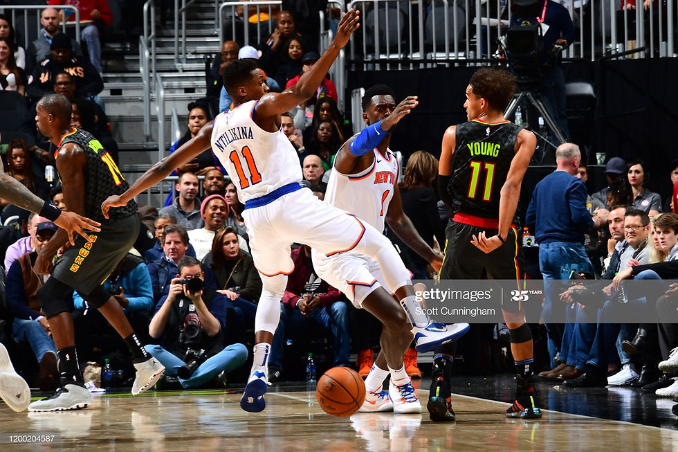 ATLANTA, GA - FEBRUARY 9: Trae Young #11 of the Atlanta Hawks passes the ball against the New York Knicks on February 09, 2020 at State Farm Arena in Atlanta, Georgia. (Photo by Scott Cunningham/NBAE via Getty Images)