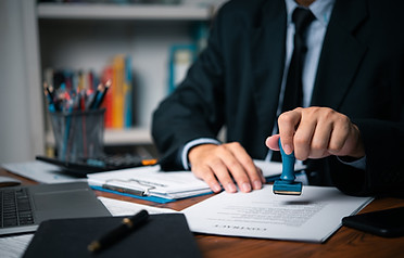 hand-man-stamping-documents-notary-public-in-offic-2023-11-27-05-22-56-utc.jpg