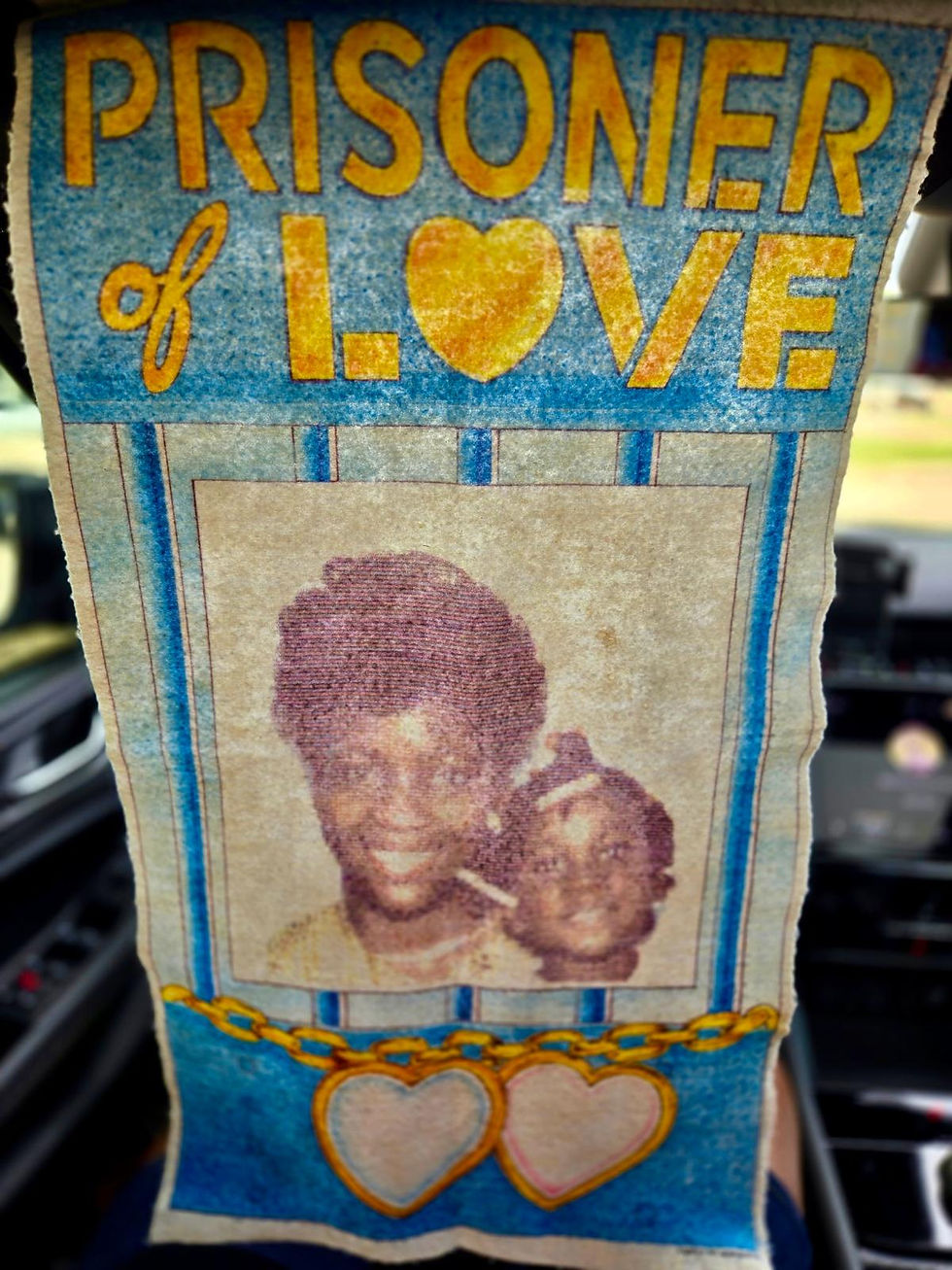A ‘photo banner’ showing Dawn Higgins Cardoza with her daughter, Dominique, is one of the few mementoes Dominique has.