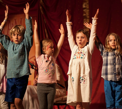 kids on stage uppy arms.jpg