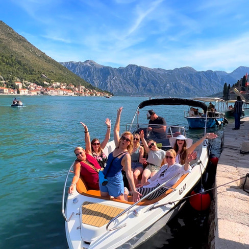 Travel Queens in our speed boat on the Bay of Kotor, Perast, Montenegro on our women-only group holiday tour Balkan Adventure