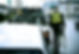 Man attaching car to tow truck