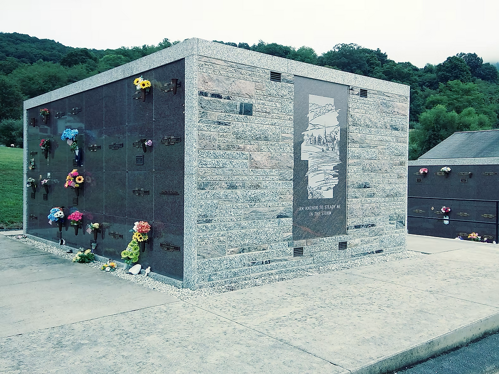 Modern granite mausoleum crypt building at Potomac Memorial Gardens featuring a clean, contemporary design with textured ston
