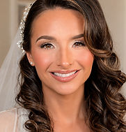 Soft, timeless bridal glam featuring radiant skin, softly sculpted eyes, defined brows, and glossy nude lips, paired with pol