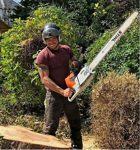 Daniel tree surgeon holding a large chainsaw