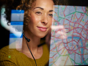A dispatcher looking at a map