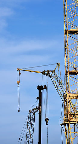 low-angle-view-crane-against-clear-blue-sky.jpg