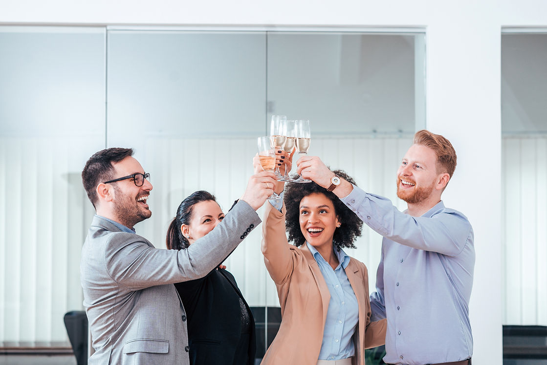business-people-celebrating-success-with-glass-champagne.jpg