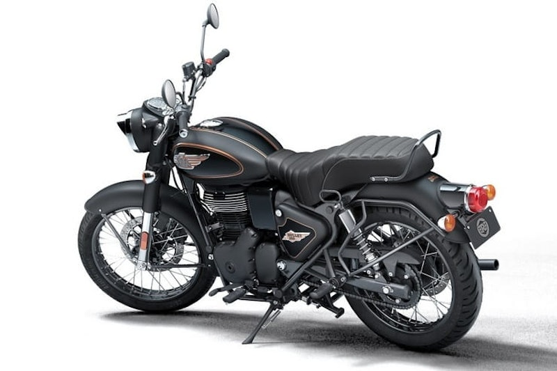 Vintage-style black motorcycle with chrome accents on a white background; features a leather seat and embossed tank logo.