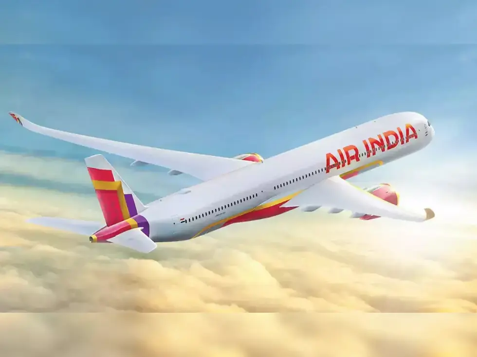 Airplane with "Air India" text flies over clouds in a blue sky. The plane features red, yellow, and purple colors on its tail.