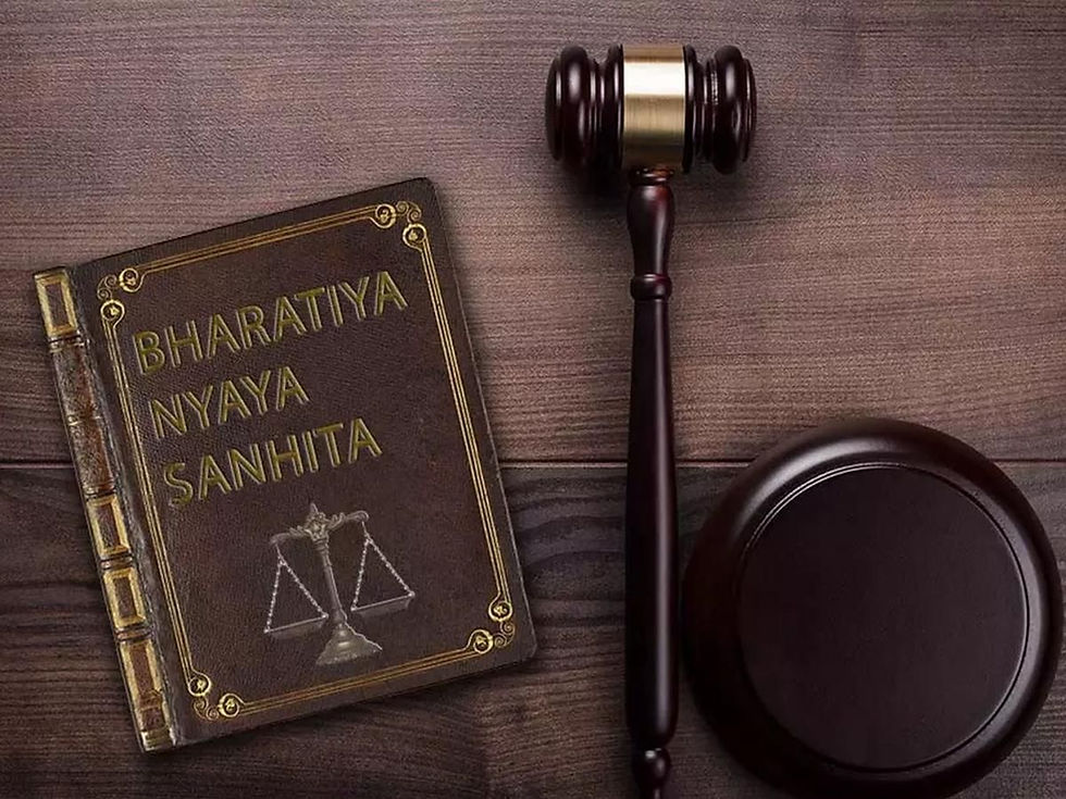 A book titled "Bharatiya Nyaya Sanhita" lies beside a wooden gavel and sound block on a wooden surface, symbolizing law and justice.